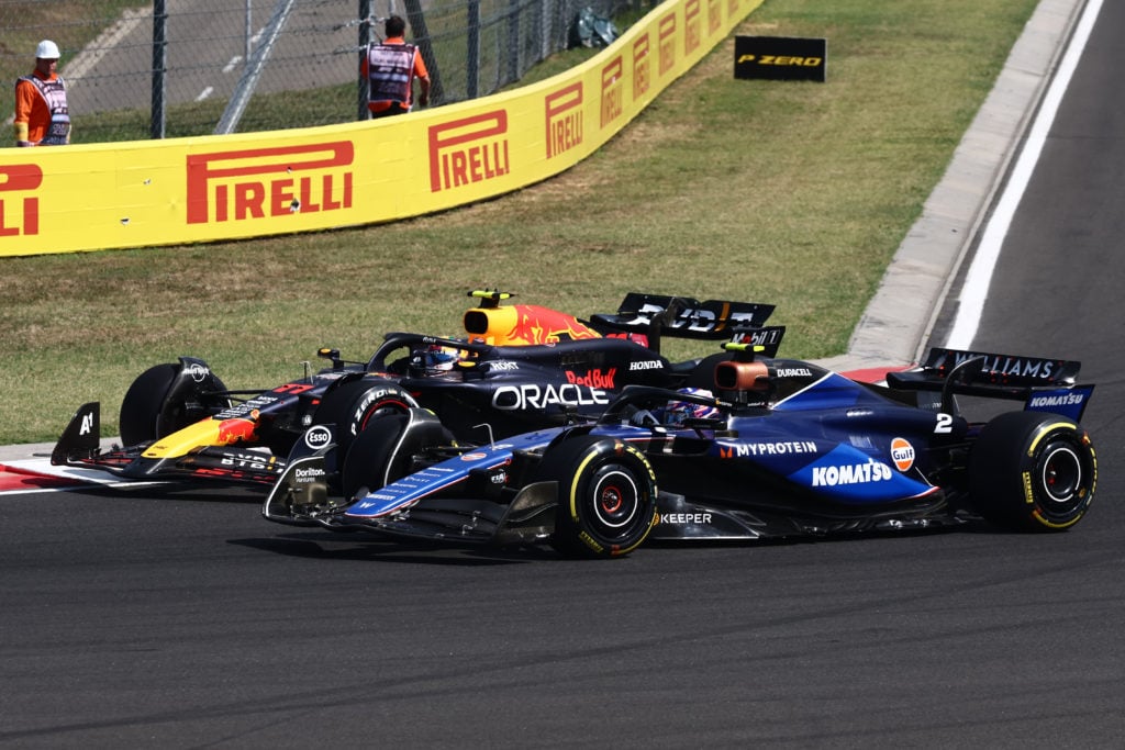 Logan Sargeant of Williams and Sergio Perez of Red Bull Racing during the Formula 1 Hungarian Grand Prix at Hungaroring in Budapest, Hungary on Jul...