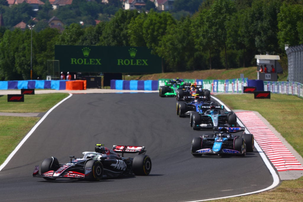 Nico Hulkenberg of Germany driving the (27) Haas F1 VF-24 Ferrari leads Esteban Ocon of France driving the (31) Alpine F1 A524 Renault during the F...