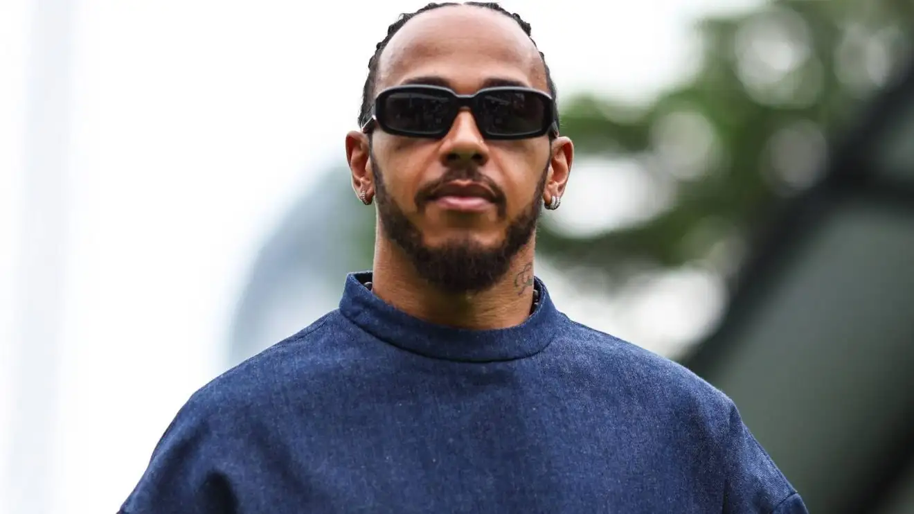 Lewis Hamilton in the F1 paddock, wearing street clothes, ahead of the 2024 Singapore Grand Prix.