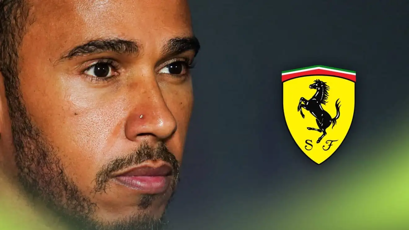 c-633 A close-up shot of Lewis Hamilton with a prominent Ferrari logo alongside him