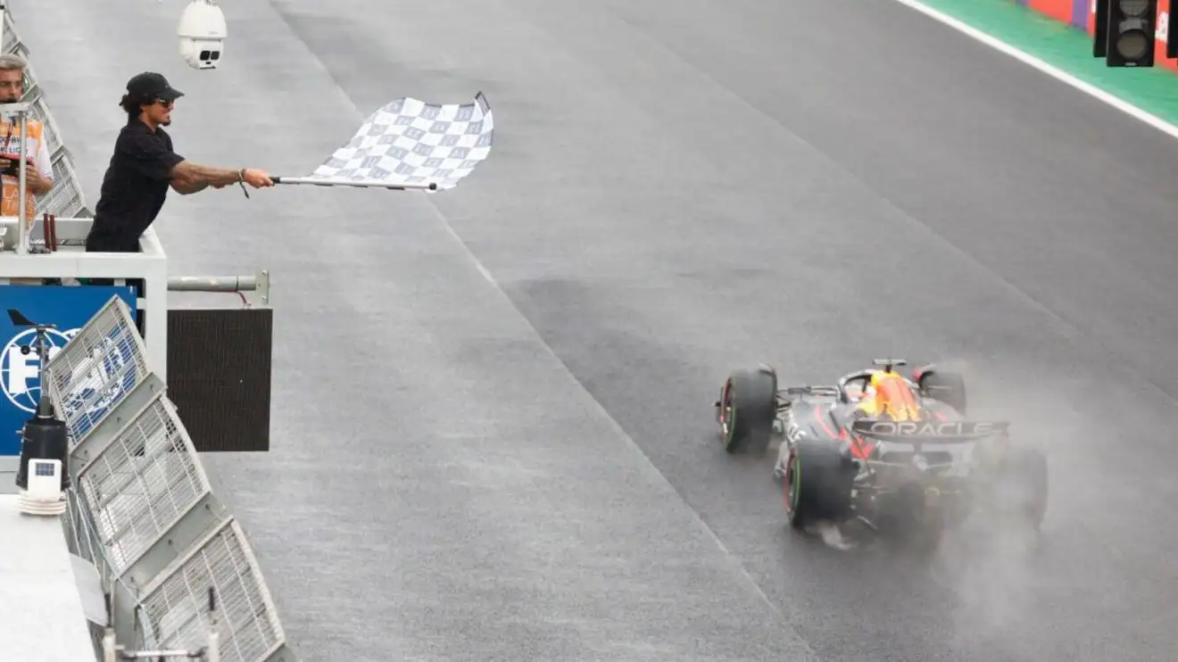 c-669 Max Verstappen takes the chequered flag in Brazil