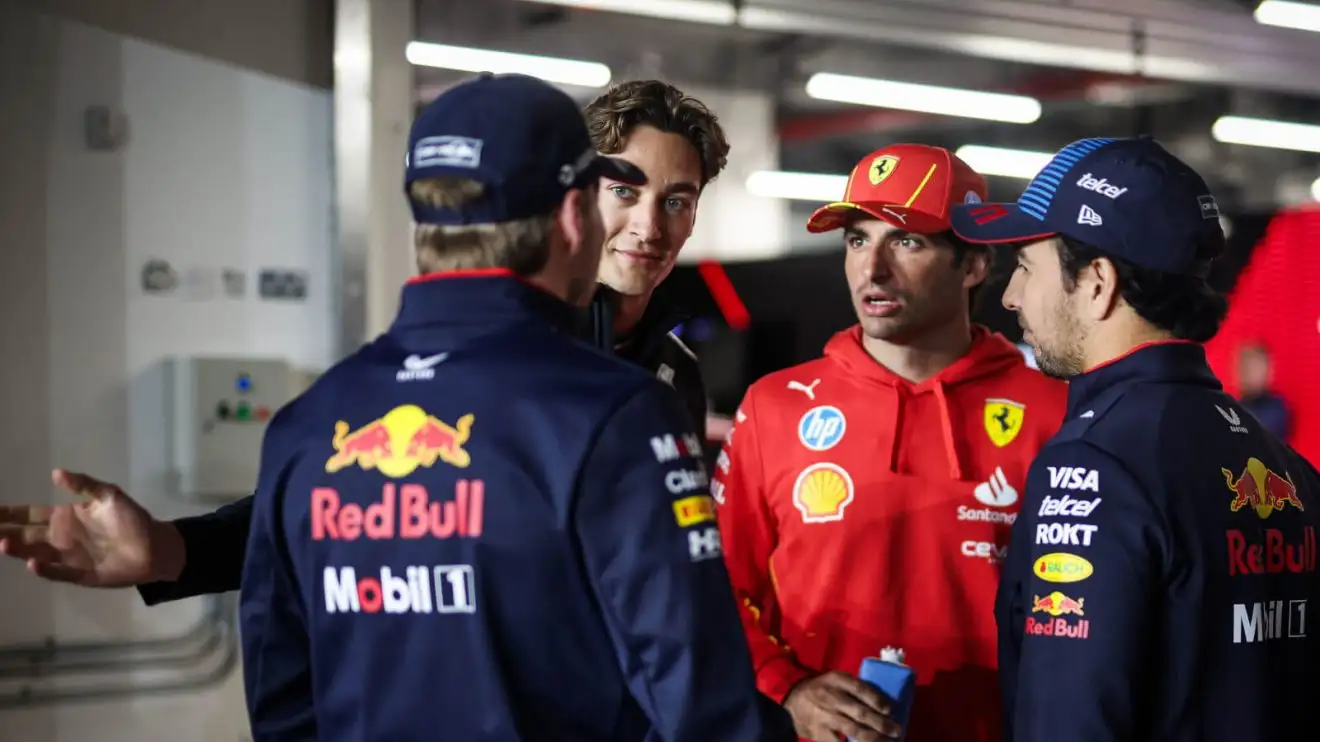 c-705 Max Verstappen speaking with George Russell, Carlos Sainz and Sergio Perez