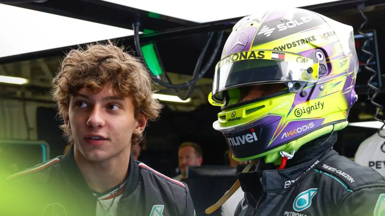 c-717 Andrea Kimi Antonelli stands alongside a race-ready Lewis Hamilton in the Mercedes garage