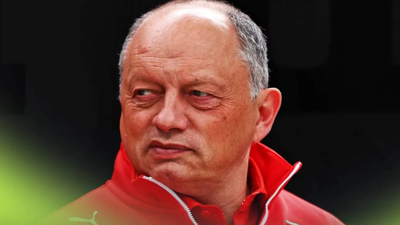 c-723 A close-up shot of Fred Vassuer looking to his left against a black background, Ferrari team principal.