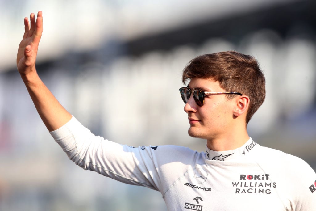 gettyimages-1191219467-2-1024x683-1 George Russell of Great Britain and Williams waves to the crowd on the drivers parade before the F1 Grand Prix of Abu Dhabi at Yas Marina Circuit o...