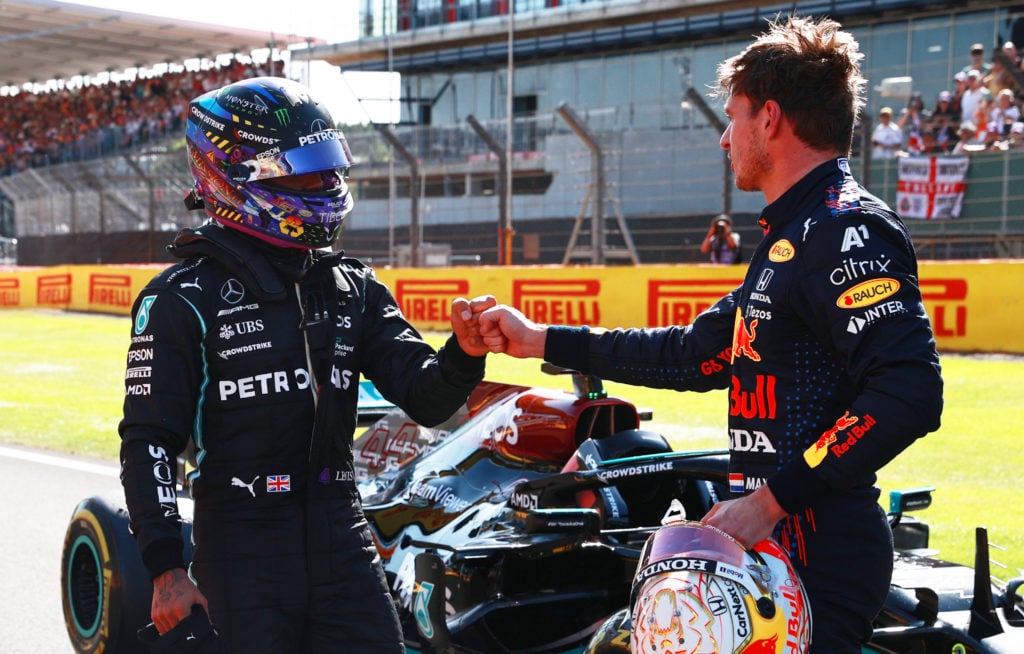 gettyimages-1329692782-1024x654-1 Winner Max Verstappen of Netherlands and Red Bull Racing and second placed Lewis Hamilton of Great Britain and Mercedes GP bump fists in parc ferme...