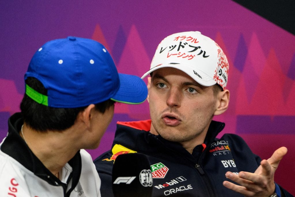 gettyimages-2128608337-1024x683-1 Red Bull Racing's Dutch driver Max Verstappen (R) talks with Honda RBPT's Japanese driver Yuki Tsunoda (L) during a press conference ahead of the F...