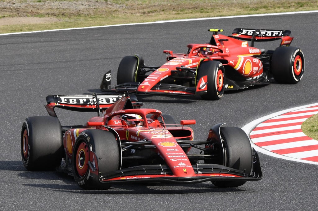 gettyimages-2136587435-1024x682-1 Ferrari's Monegasque driver Charles Leclerc (bottom) and Ferrari's Spanish driver Carlos Sainz Jr (behind) take a turn during the Formula One Japan...