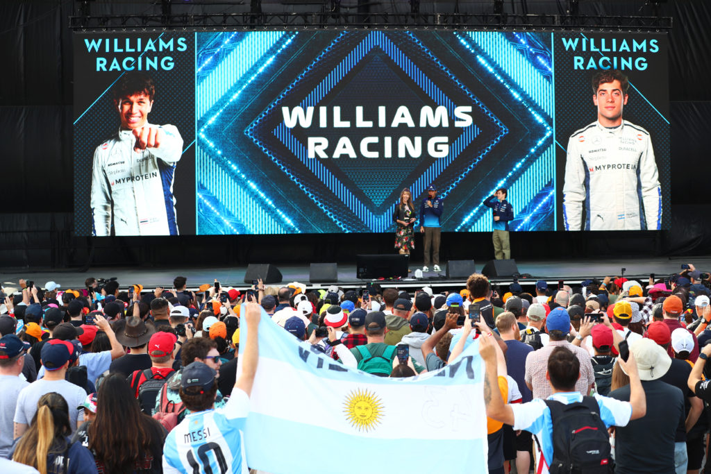 gettyimages-2179281862-1024x683-1 Alexander Albon of Thailand and Williams and Franco Colapinto of Argentina and Williams talk to the crowd on the fan stage prior to practice ahead ...