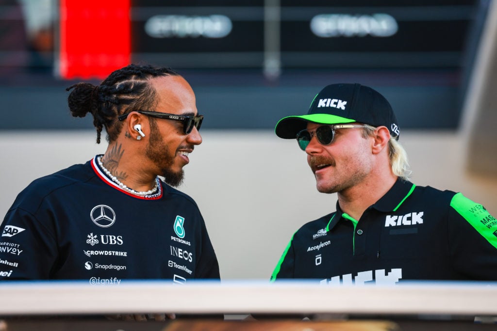 Lewis Hamilton of Great Britain and Mercedes talks with Valtteri Bottas of Finland and Stake F1 Team Kick Sauber at the drivers' parade during the ...