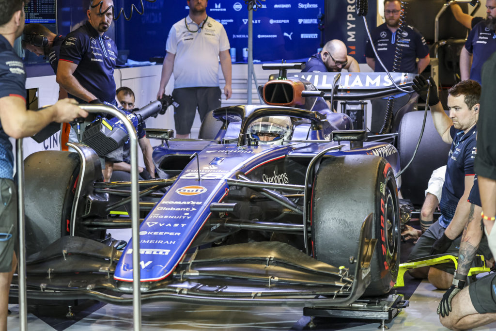 gettyimages-2188890987-1024x683-1 Carlos Sainz of Spain spotted in the car in the pit with his new team Williams. Sainz, driver of Williams Racing Formula One Team with a white helm...