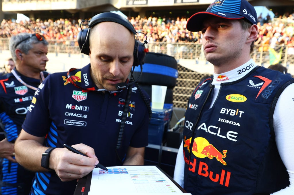 gettyimages-2188893142-1024x679-1 Max Verstappen of the Netherlands and Oracle Red Bull Racing and race engineer Gianpiero Lambiase talk on the grid during the F1 Grand Prix of Abu ...