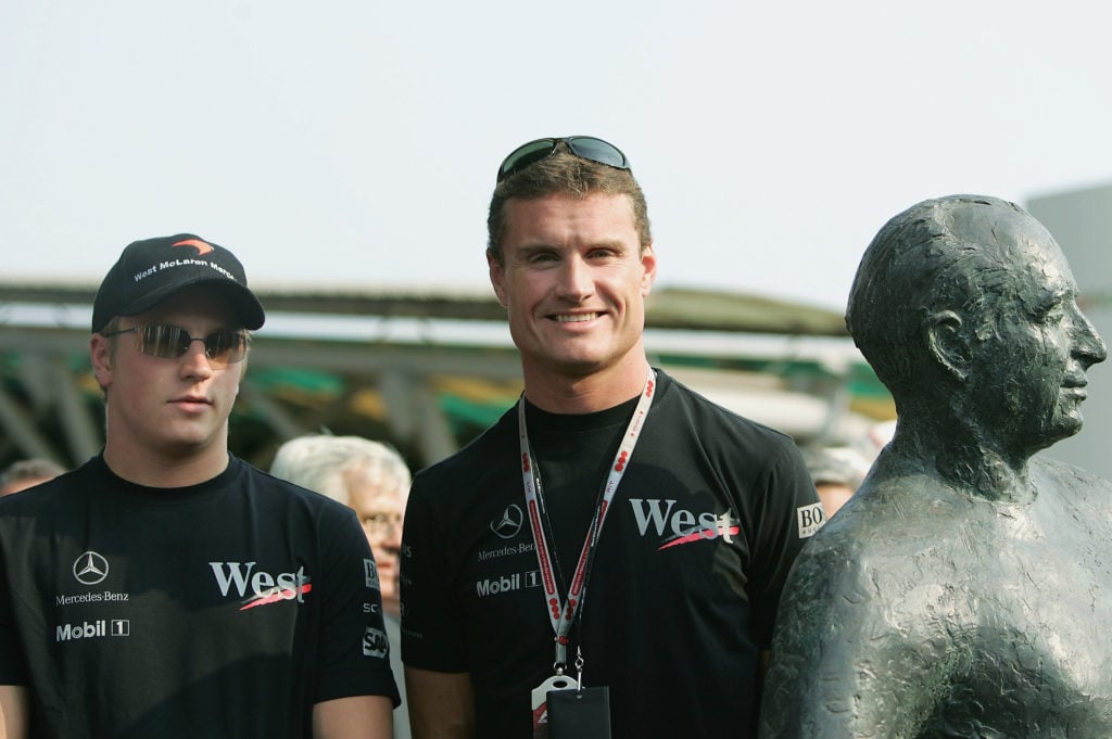 gettyimages-51277725-1024x681-1 Kimi Raikkonen of Finland and McLaren Mercedes and David Coulthard of Great Britain and McLaren Mercedes stand beside a statue of Fangio during the...