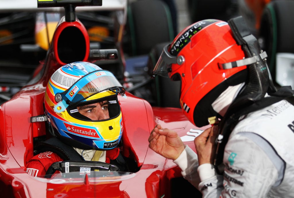gettyimages-98080051-1024x692-1 Fernando Alonso (L) of Spain and Ferrari talks with Michael Schumacher (R) of Germany and Mercedes GP in parc ferme after qualifying for the Austra...