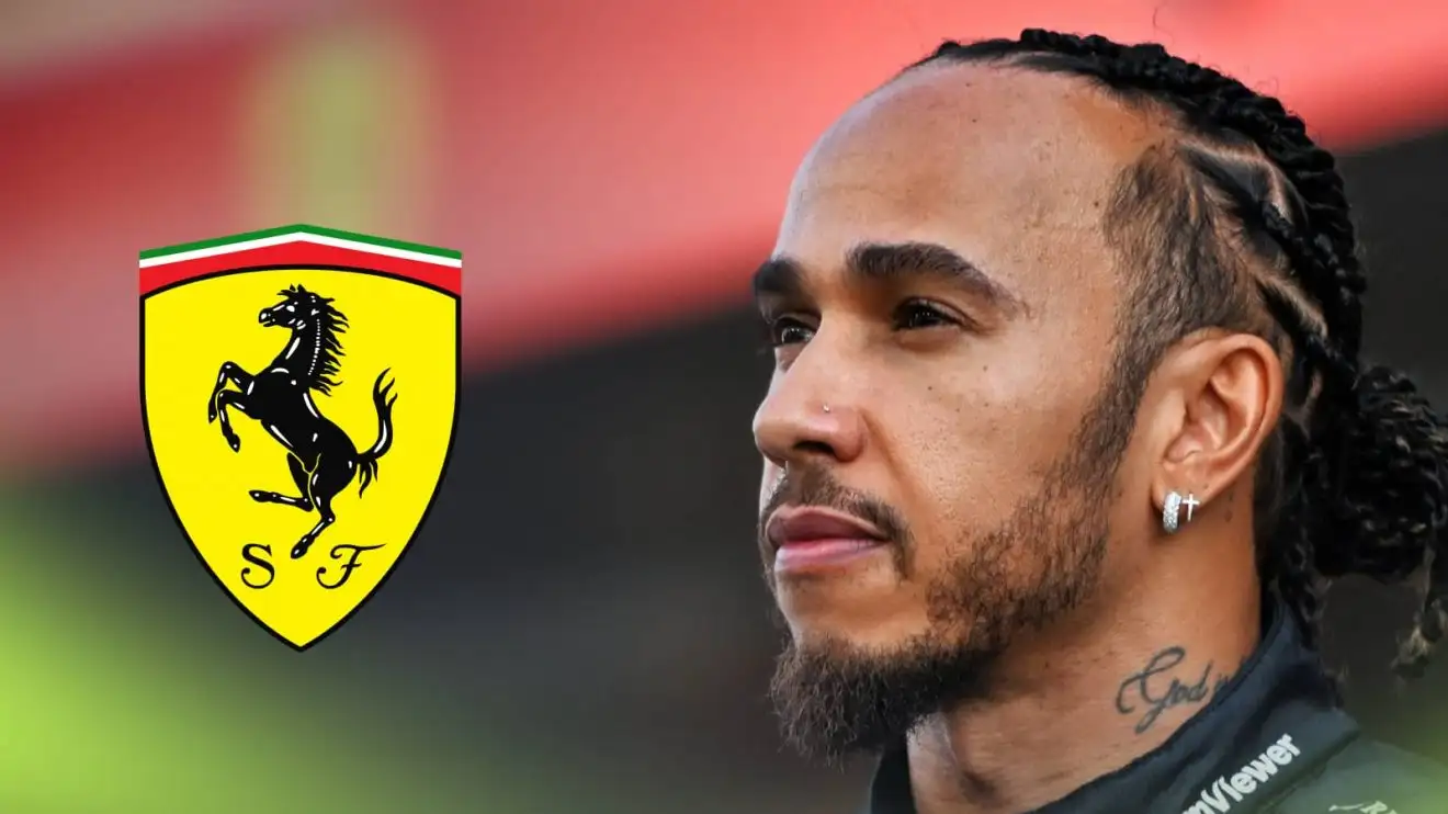 c-420 Lewis Hamilton poses at Mercedes' end-of-2024 photocall with a prominent Ferrari logo alongside him
