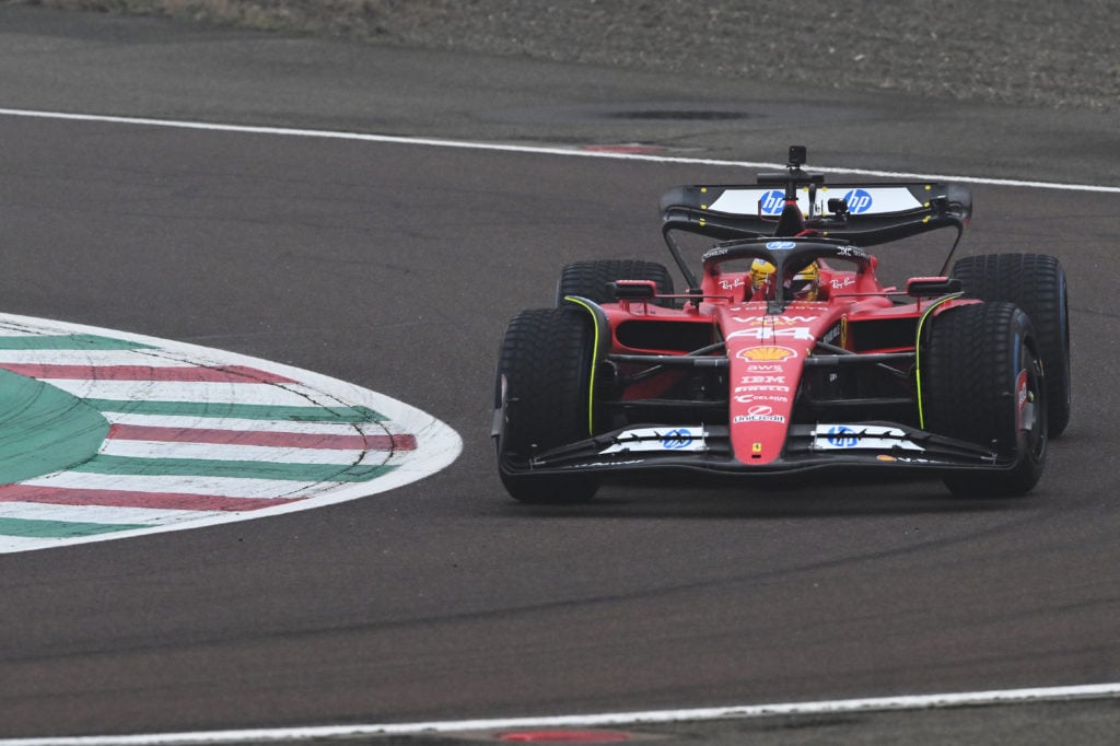 gettyimages-2195225751-1024x682-1 Lewis Hamilton of Great Britain waves to the crowd as he drives the (44) Ferrari SF-23 during his first official days as a Scuderia Ferrari F1 driv...