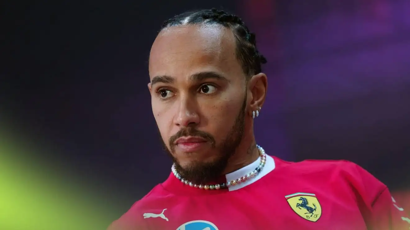 Lewis Hamilton looks concerned in a press conference
