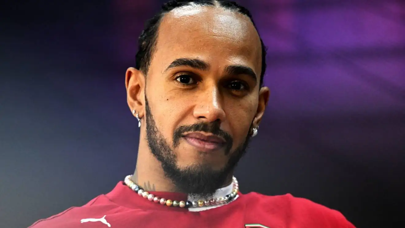 c-322 Ferrari's Lewis Hamilton smiles and looks at the camera at 2025 Bahrain pre-season testing