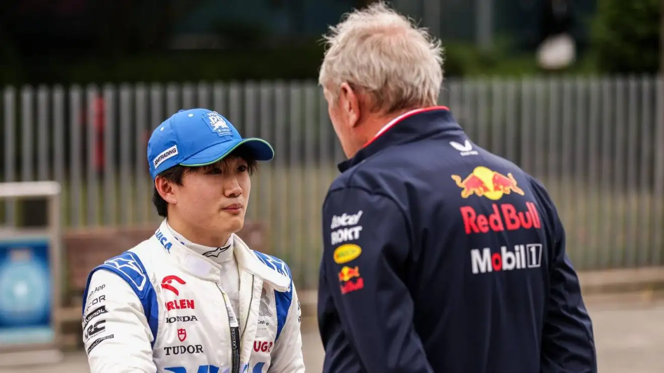 c-328 Yuki Tsunoda and Helmut Marko in conversation at the 2024 Chinese Grand Prix.