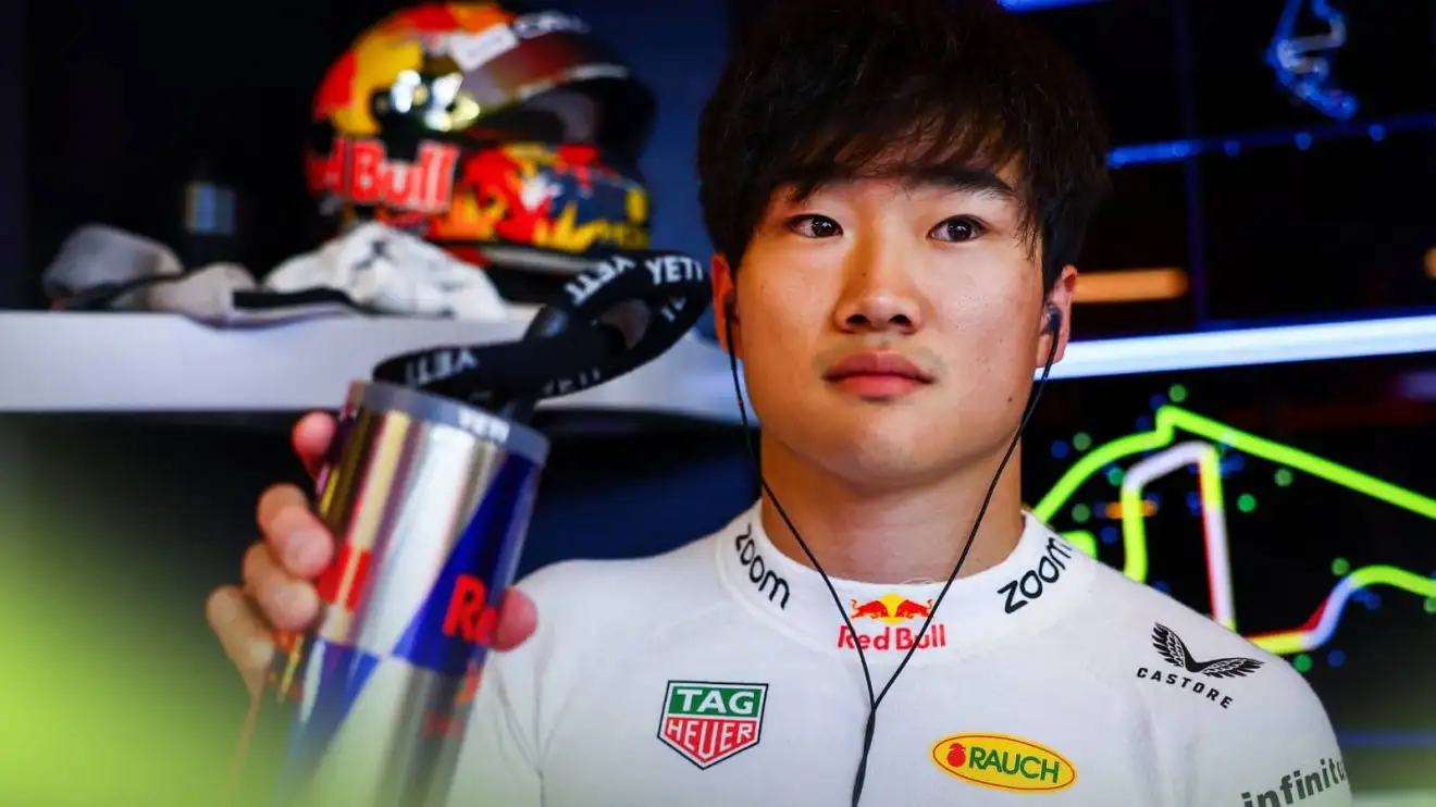 c-334 Yuki Tsunoda holds a can of Red Bull in the team's garage in Abu Dhabi