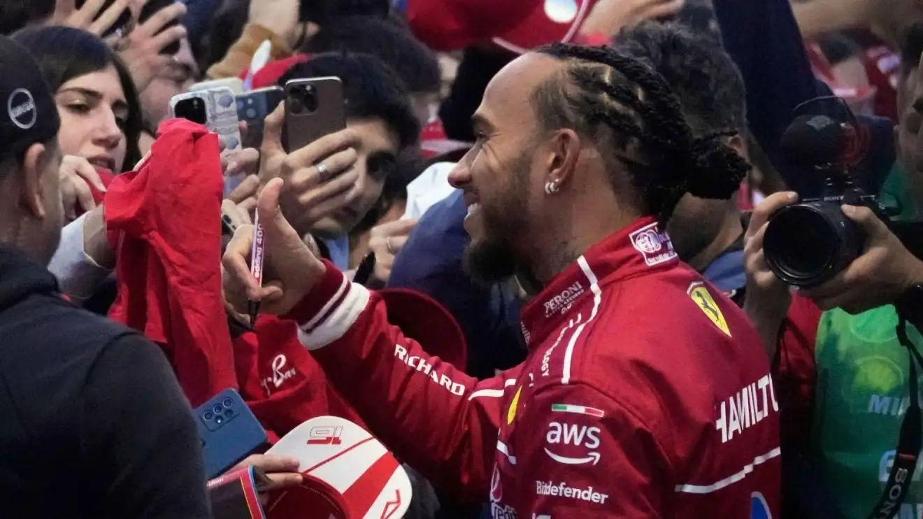 c-361 Lewis Hamilton engages with the Ferrari fans at a street event in Milan