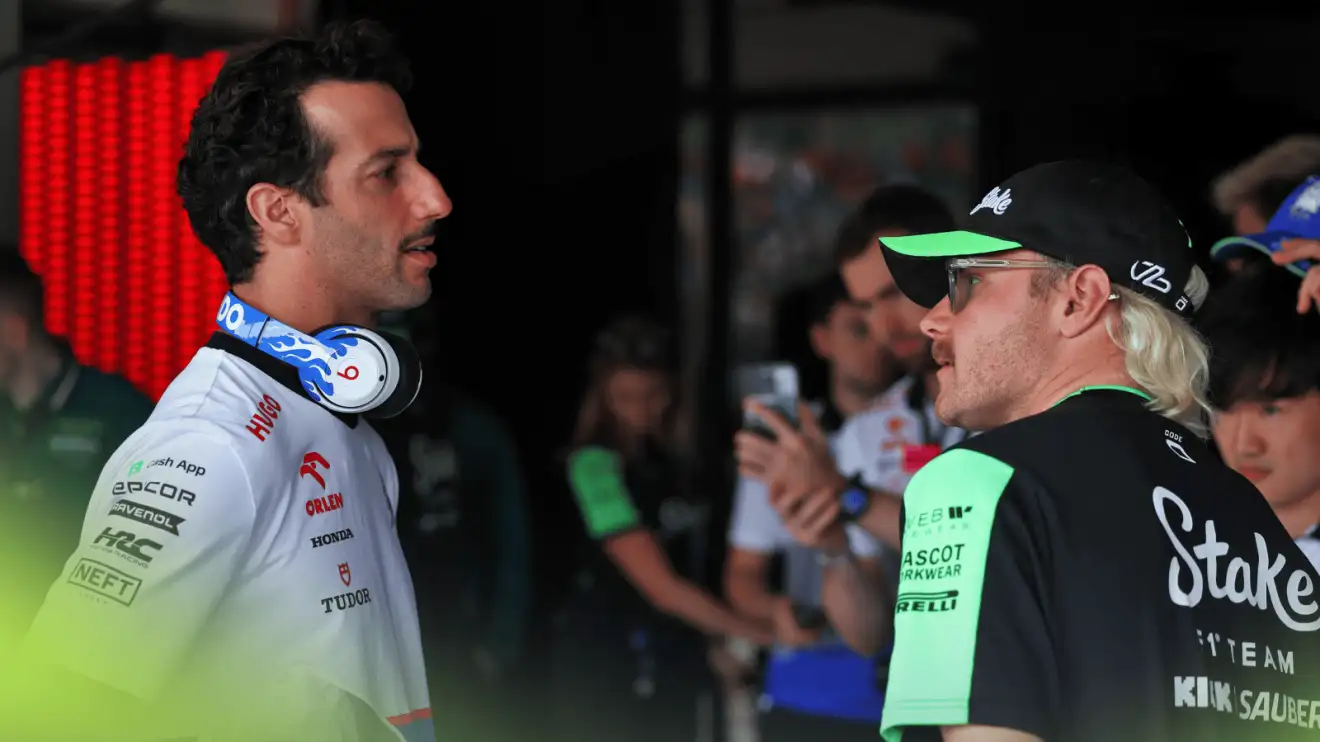 c-385 Daniel Ricciardo and Valtteri Bottas in conversation in the F1 paddock