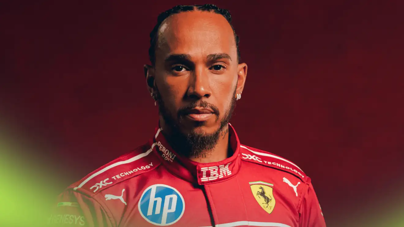 c-394 A studio shot of Lewis Hamilton posing in Ferrari overalls