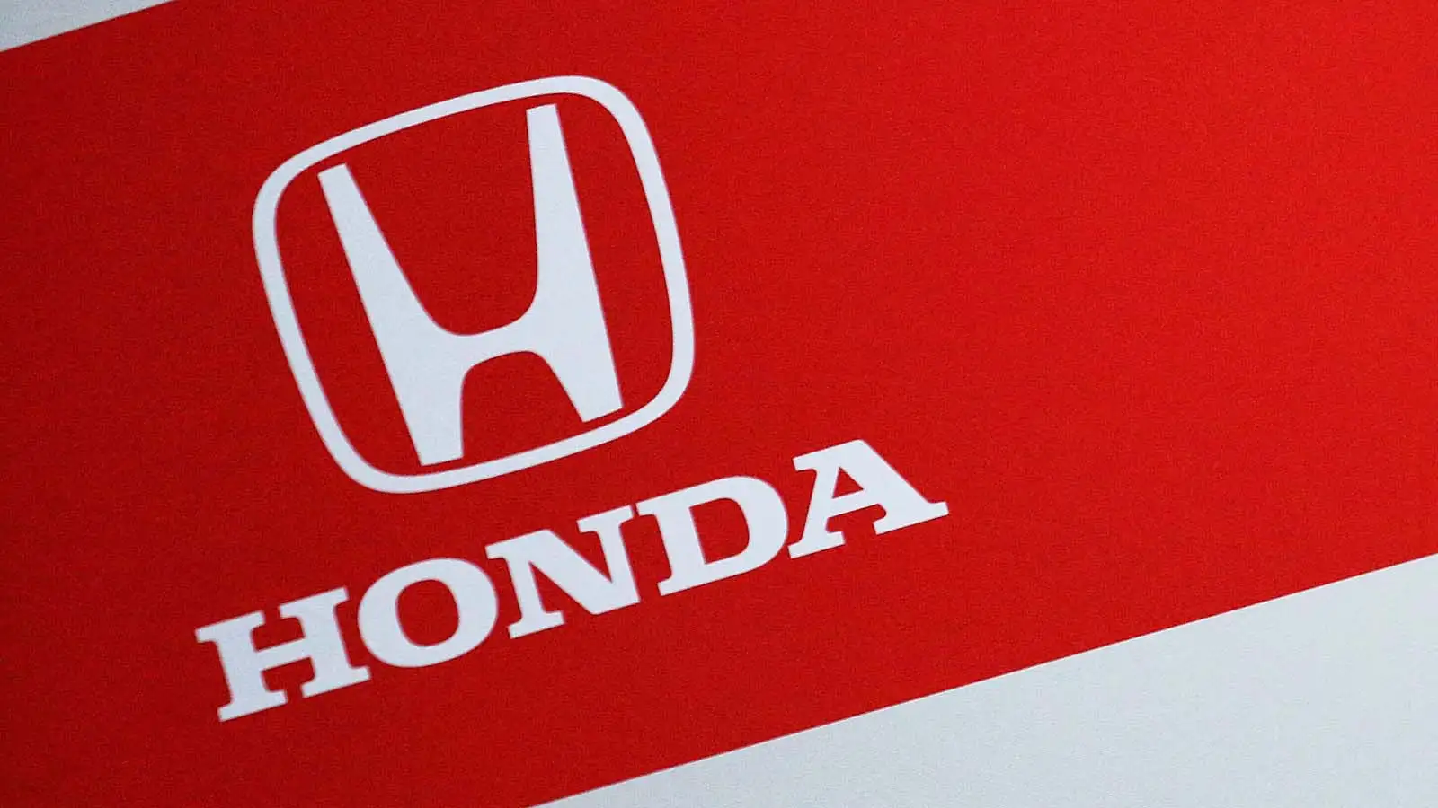 c-442 Honda logo on show on the side of the Red Bull garage.