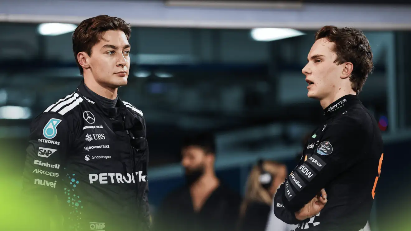 c-757 George Russell looks on while in conversation with Oscar Piastri in parc ferme in Bahrain