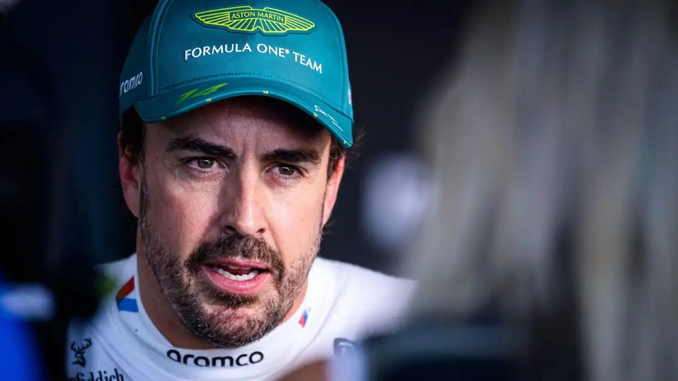 c-1038 Fernando Alonso speaks to television reporters following the Emilia Romagna Grand Prix.