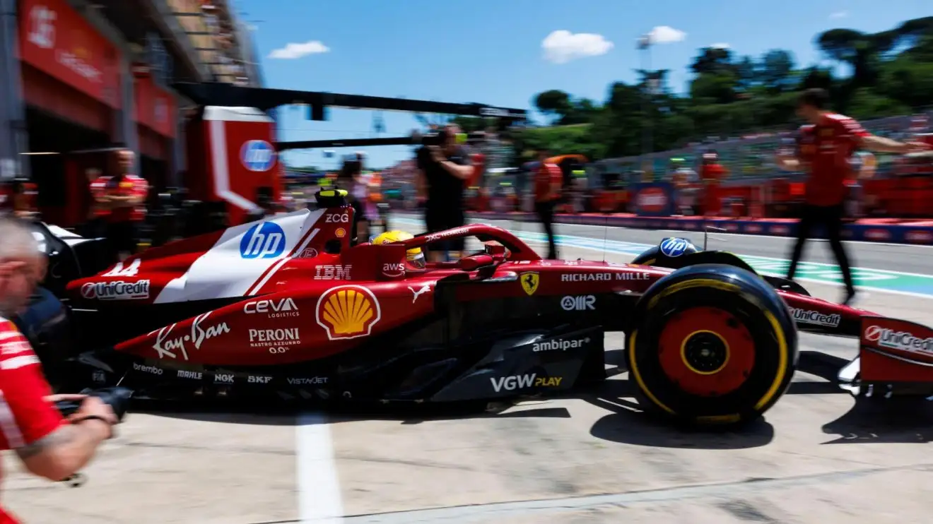 c-1044 Lewis Hamilton exits his Ferrari garage and drivers into the Imola pit lane.