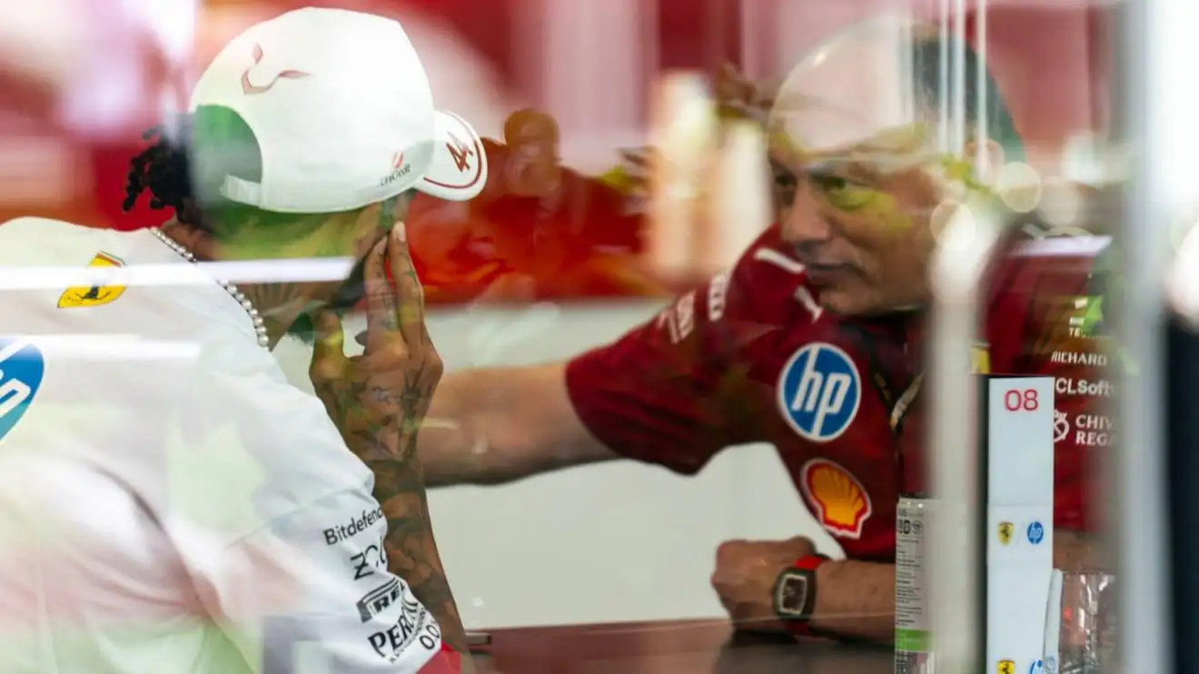 c-1149 Ferrari's Lewis Hamilton and Fred Vasseur in discussion at the 2025 Miami Grand Prix