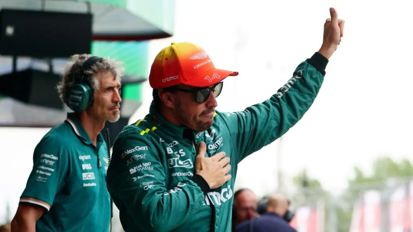 Fernando Alonso waves to the fans in Barcelona