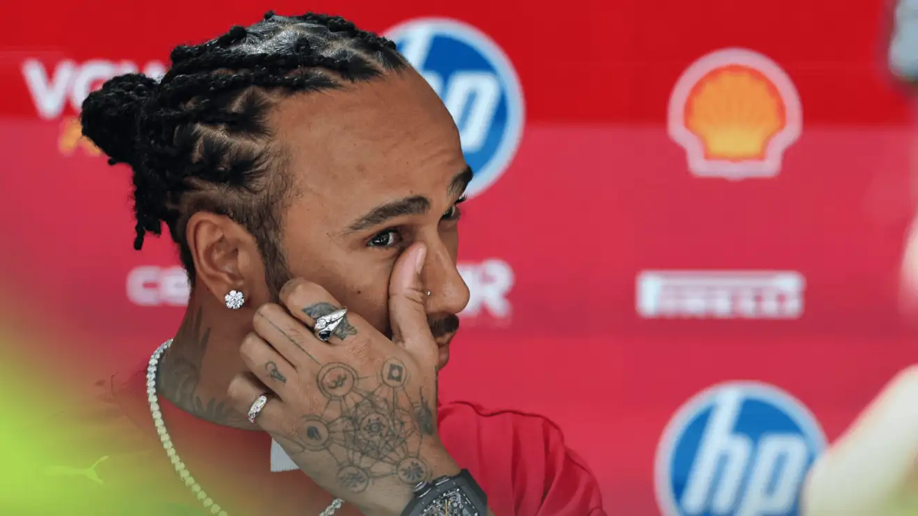 c-1583 Lewis Hamilton touches his face as he faces the media in Monaco