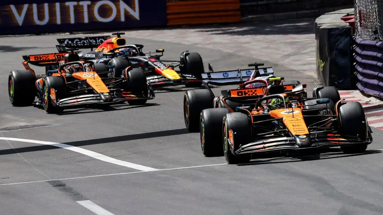 c-1637 Lando Norris leads the field out of Sainte Devote on the opening lap of the Monaco Grand Prix.