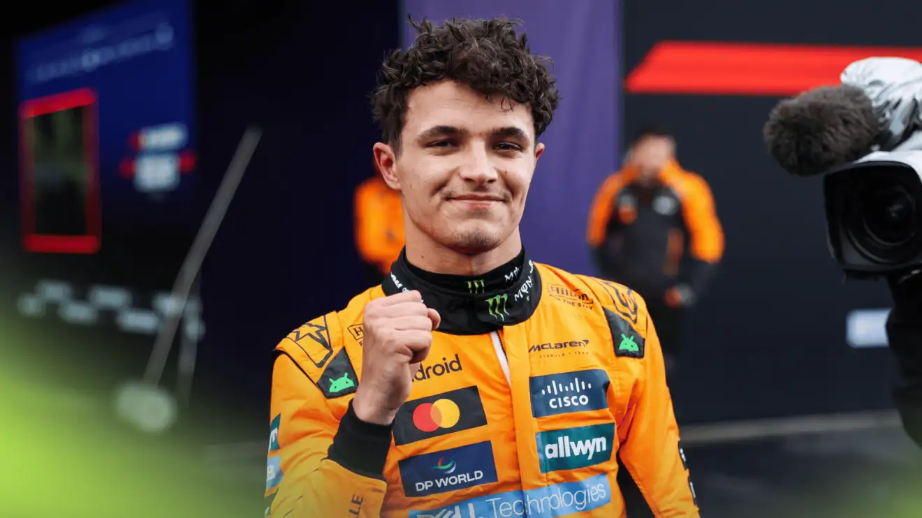 c-184 Lando Norris smiles as he holds up his fist after winning the Australian Grand Prix