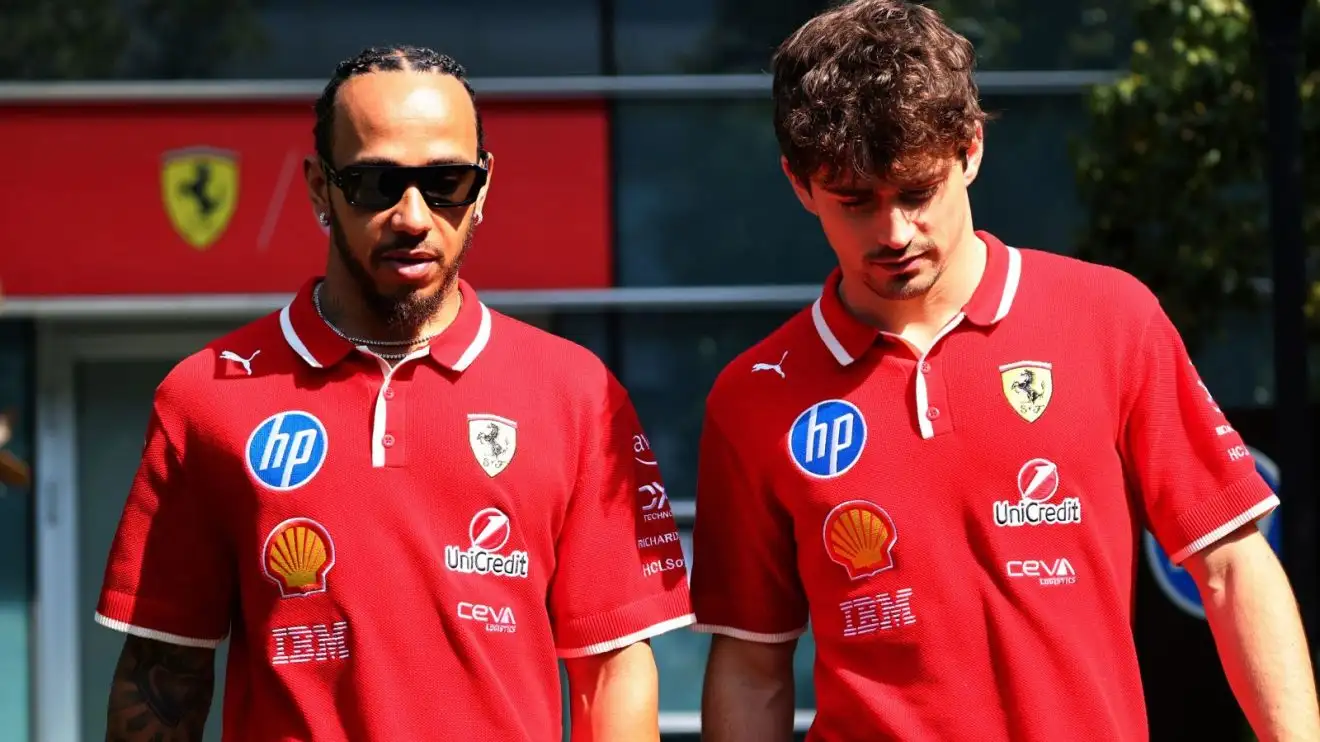 c-330 Ferrari drivers Lewis Hamilton and Charles Leclerc walk together at the 2025 Chinese Grand Prix