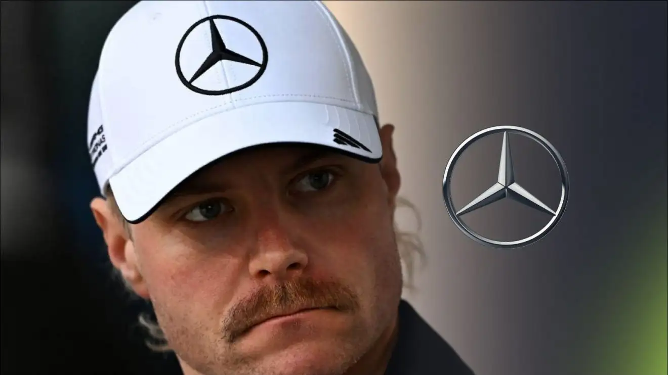 c-509 Mercedes reserve driver Valtteri Bottas looking stern at 2025 Bahrain testing, with the Mercedes logo to his right