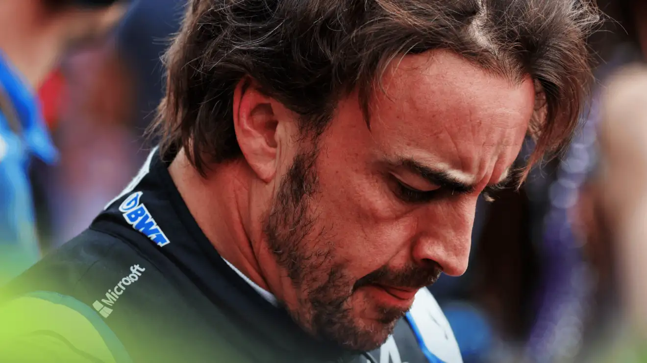 c-602 A close-up shot of Fernando Alonso with his head lowered on the grid at the 2022 Mexican Grand Prix