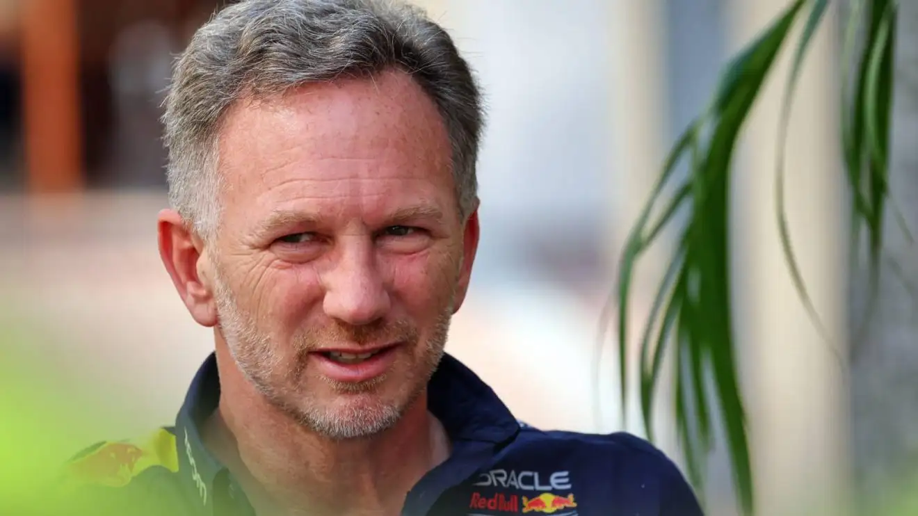 c-671 Christian Horner pictured mid-conversation in the paddock