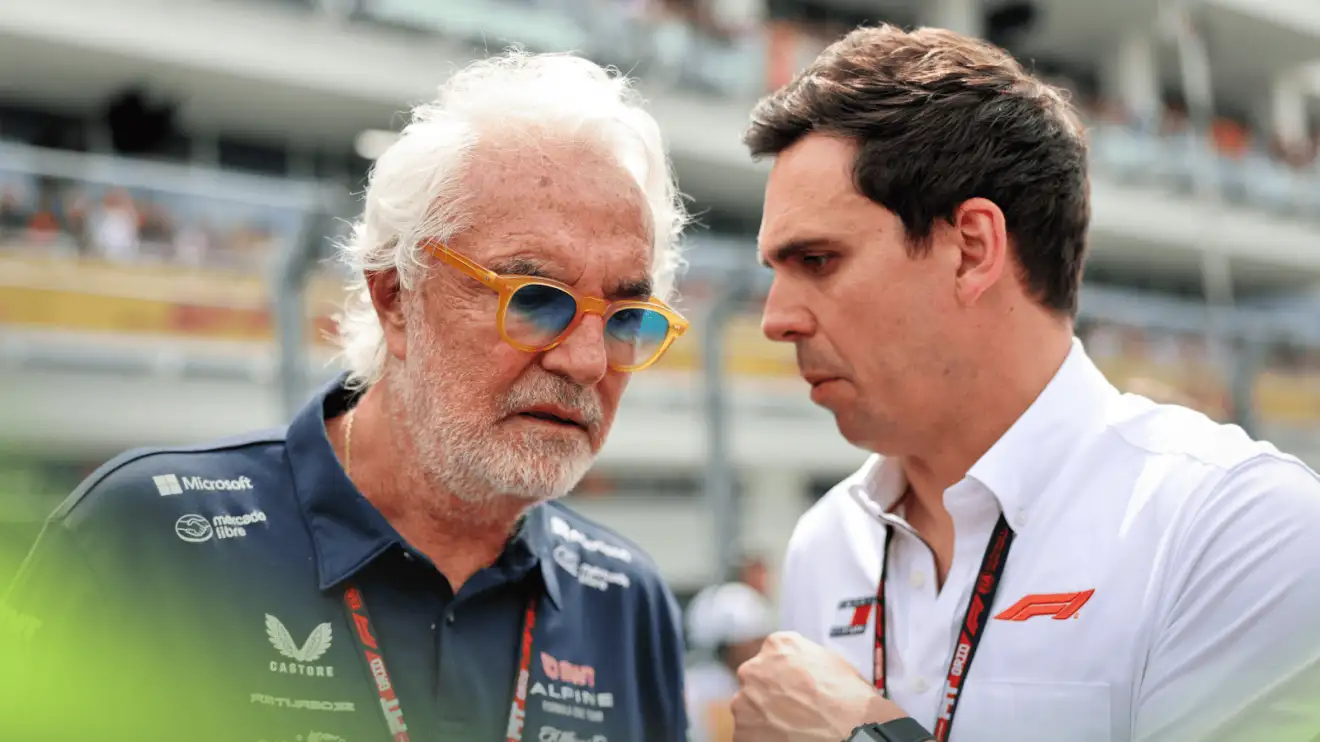 c-797 Flavio Briatore in conversation with an F1 official on the grid in Miami