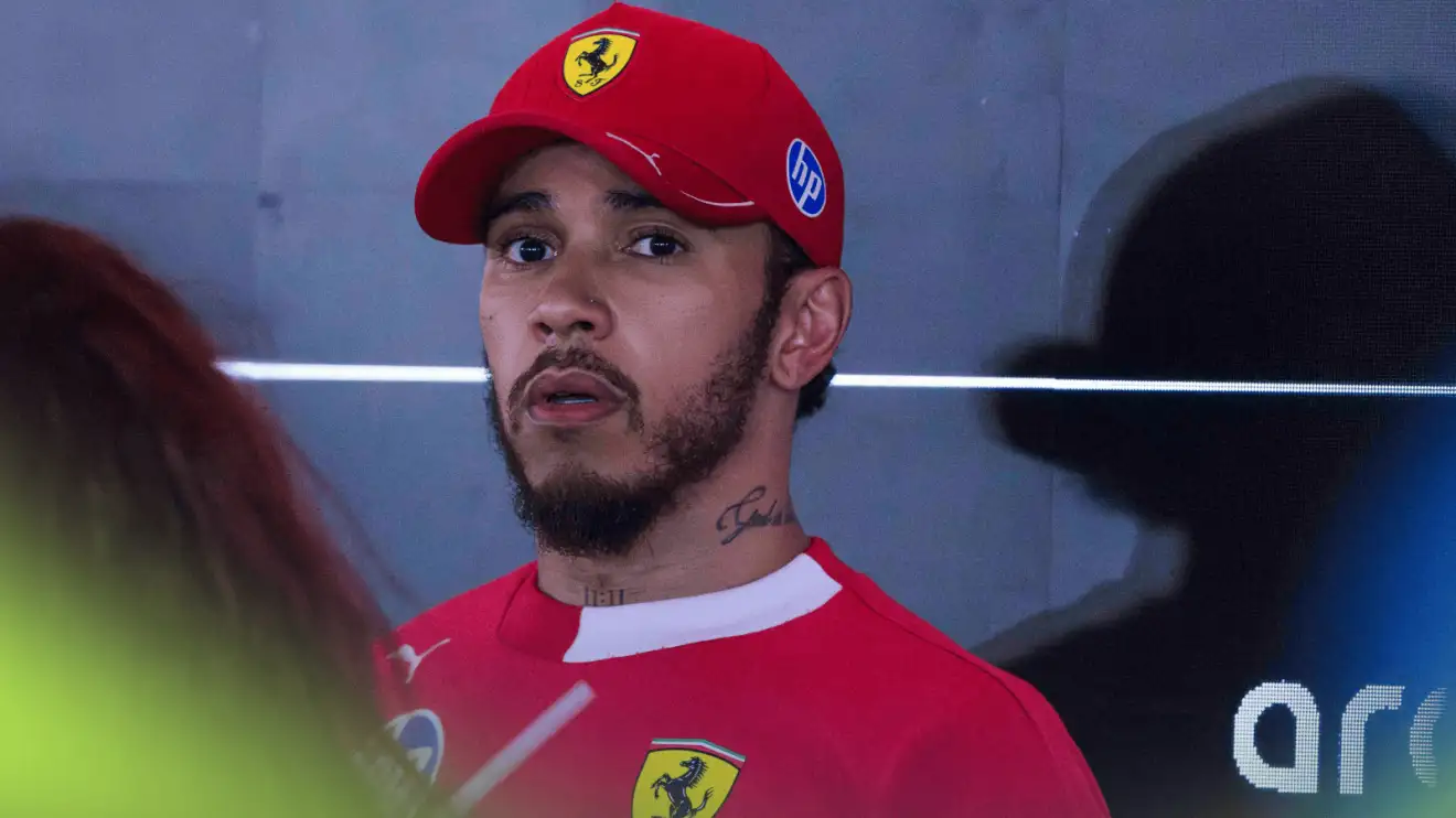 c-821 Lewis Hamilton looks distressed as he faces the media