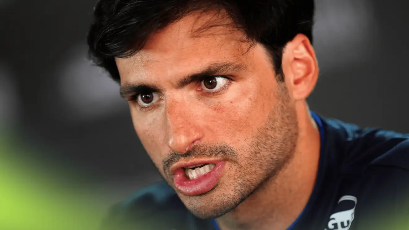 c-881 A close-up shot of Carlos Sainz speaking to the media