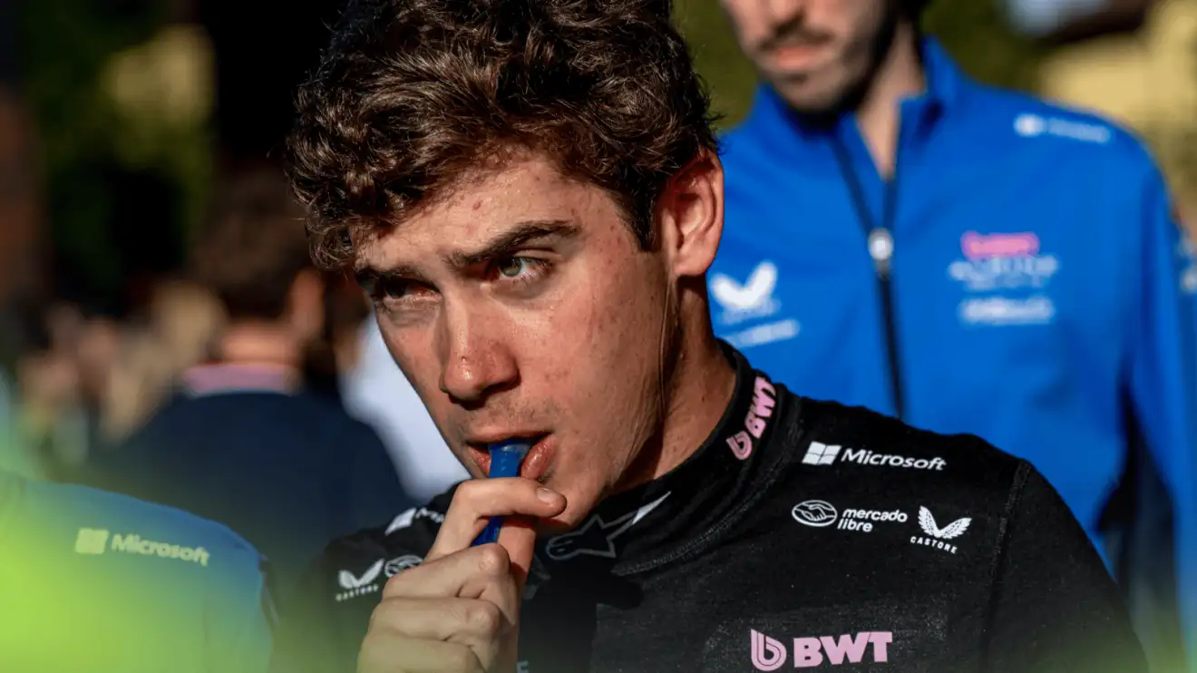 c-948 Franco Colapinto inserting a straw into his mouth at Imola