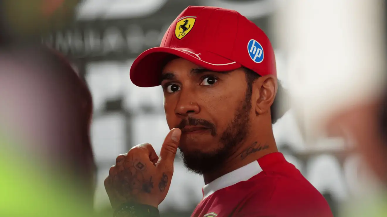 c-960 Lewis Hamilton holds his hand to his mouth in the media pen at Imola