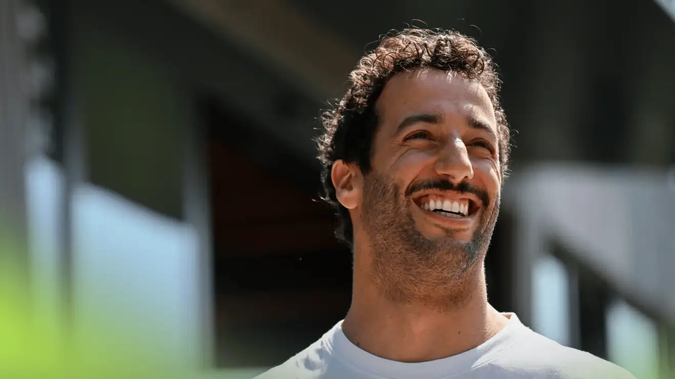 c-97 Daniel Ricciardo smiles broadly in the F1 paddock