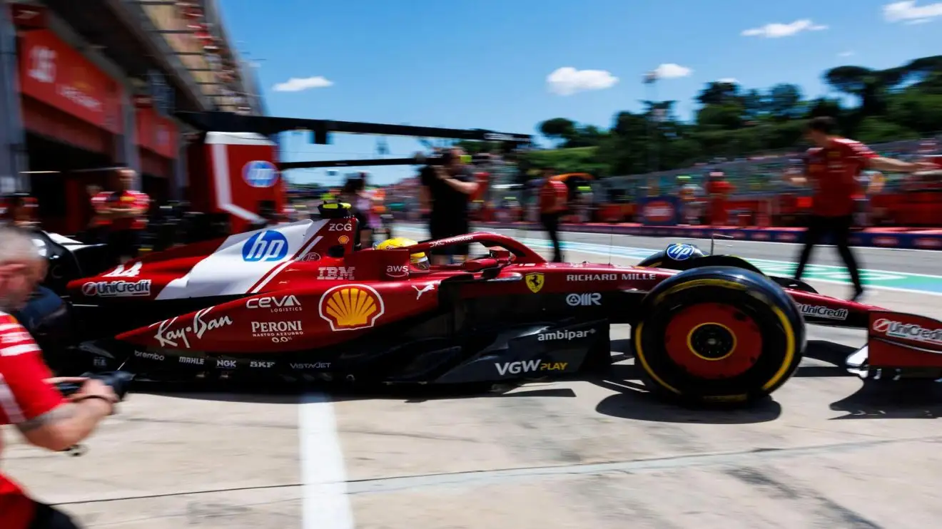 c-975 ;Hamilton drives his Ferrari out of the garage and into the Imola pit lane.