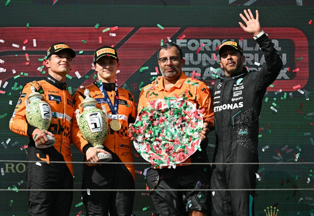 gettyimages-2162301941-1024x705-1 Lando Norris, Oscar Piastri, Randy Singh and Lewis Hamilton on the F1 podium