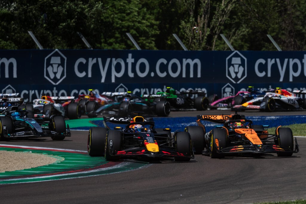 gettyimages-2215328773-1024x683-2 Red Bull driver Max Verstappen passes Oscar Piastri of McLaren to lead the 2025 F1 Emilia Romagna Grand Prix at Imola