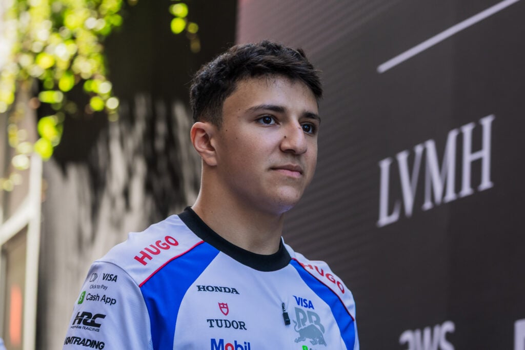 Racing Bulls driver Isack Hadjar arrives in the 2025 F1 Monaco Grand Prix paddock